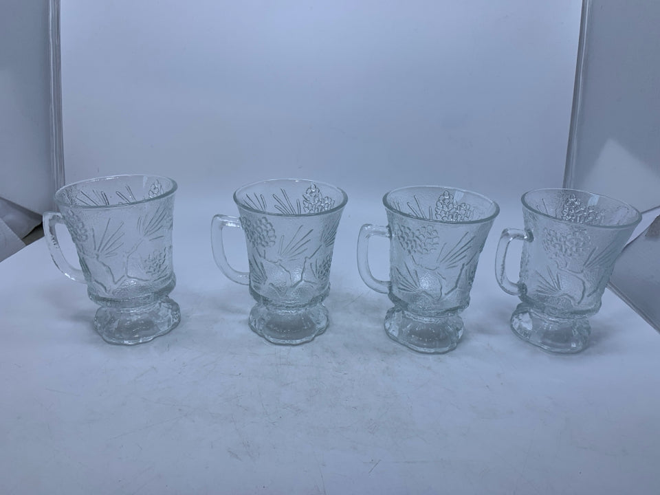 4 CLEAR FOOTED GLASS MUGS W/ EMBOSSED PINECONES.