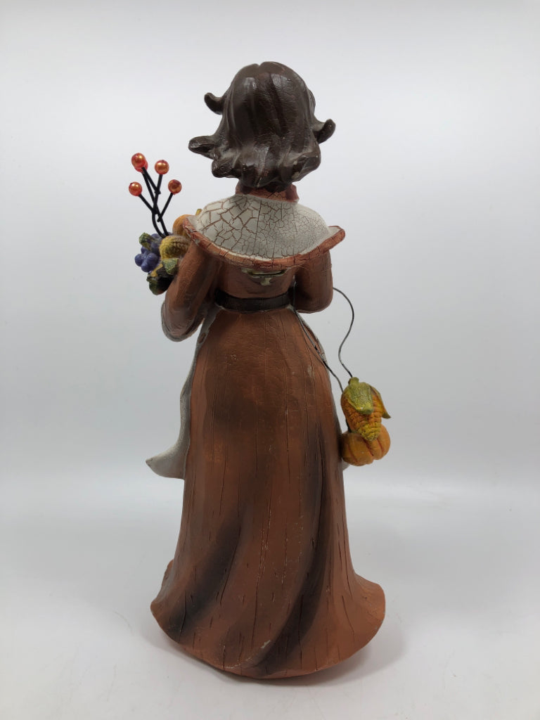 WOMAN HOLDING CORNUCOPIA "YOUNG" FIGURINE.