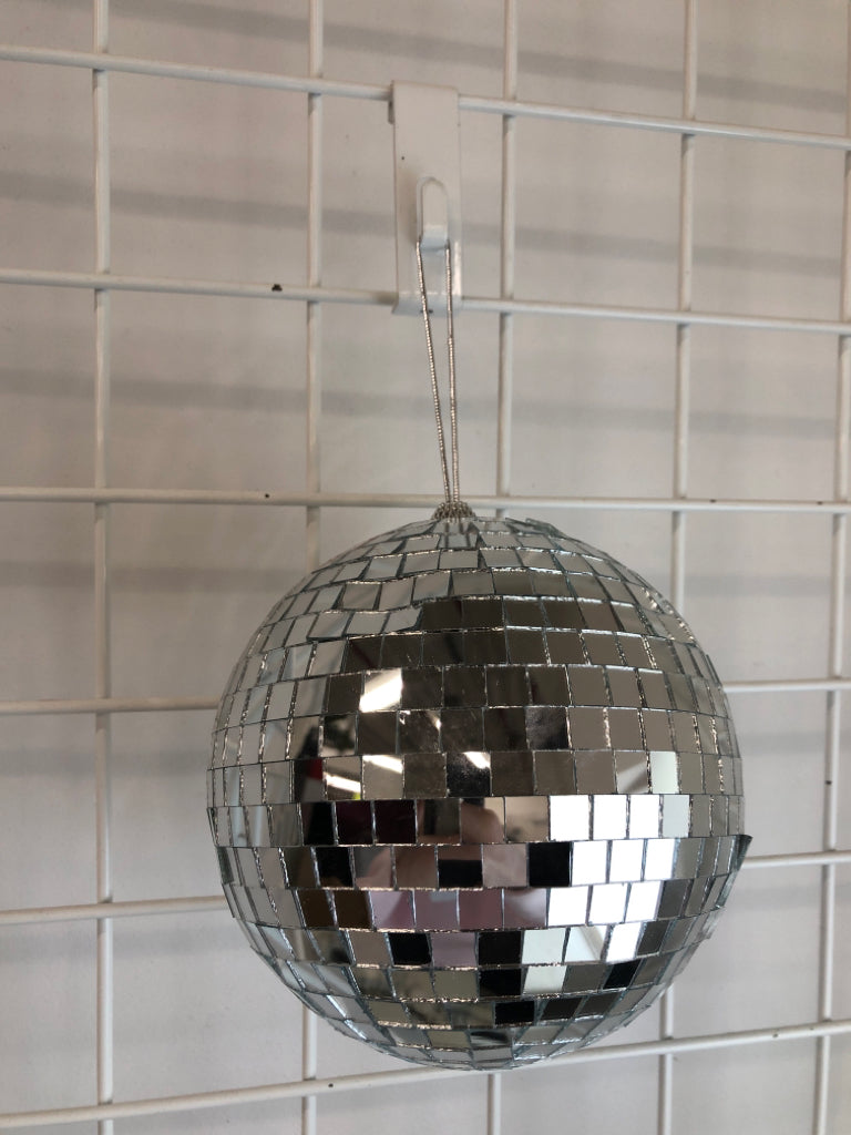 SILVER DISCO BALL ORNAMENT.