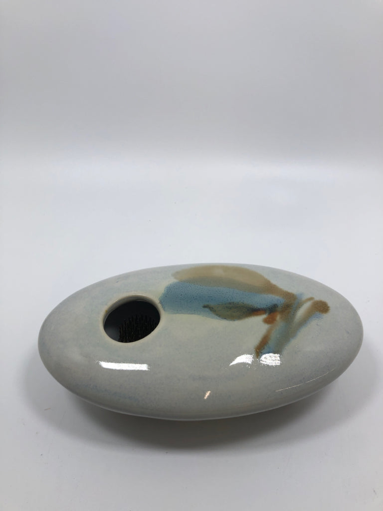 LIGHT BLUE CERAMIC FLOWER FROG.