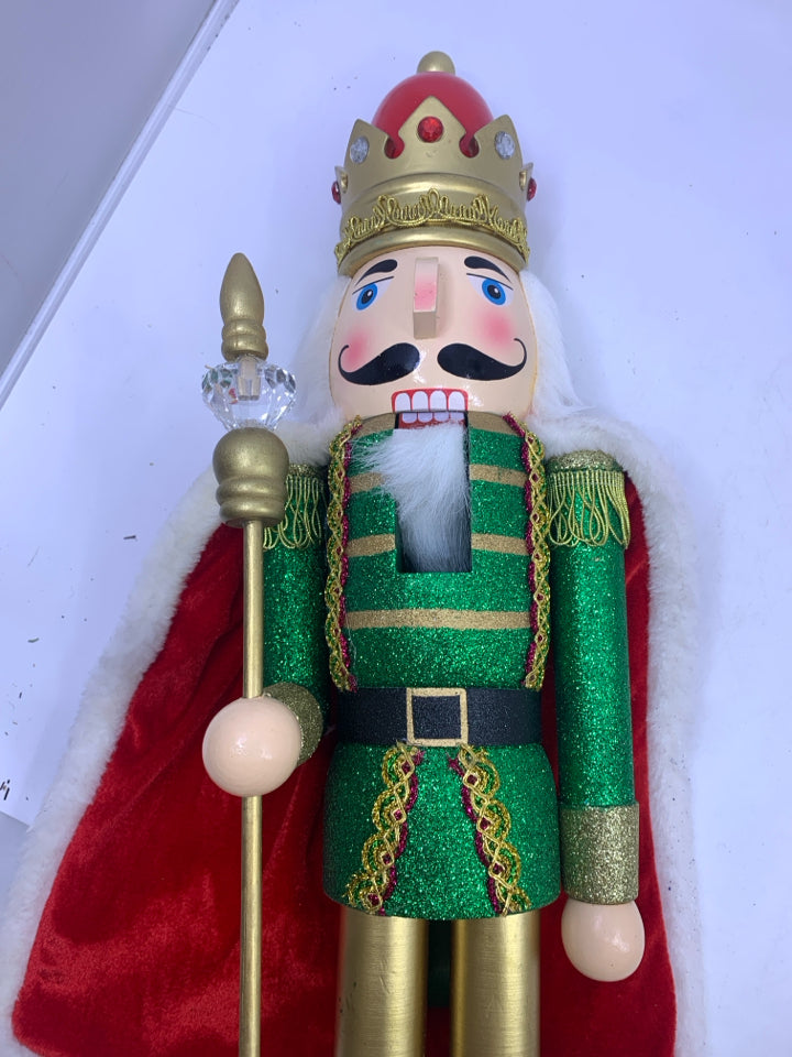 LARGE GREEN GLITTER NUTCRACKER W/CAPE.