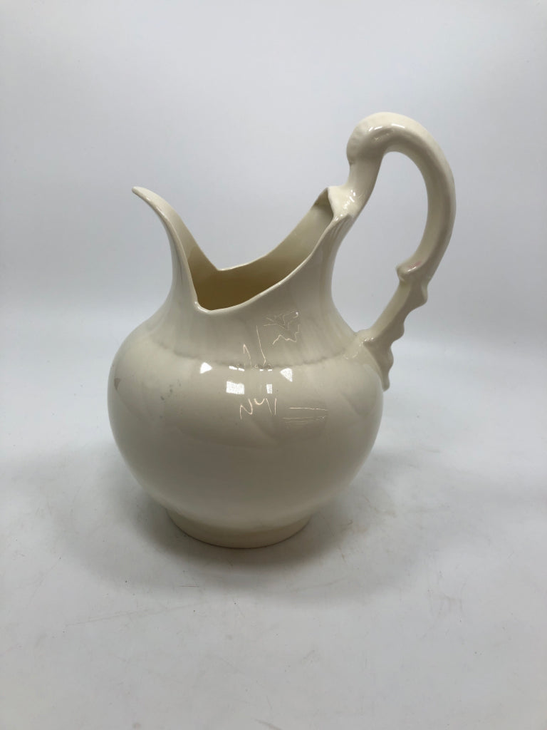 ABSTRACT CREAM COLORED PITCHER.