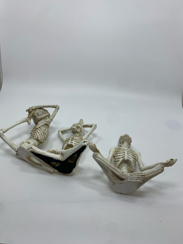 3 YOGA RESIN SKELETONS.