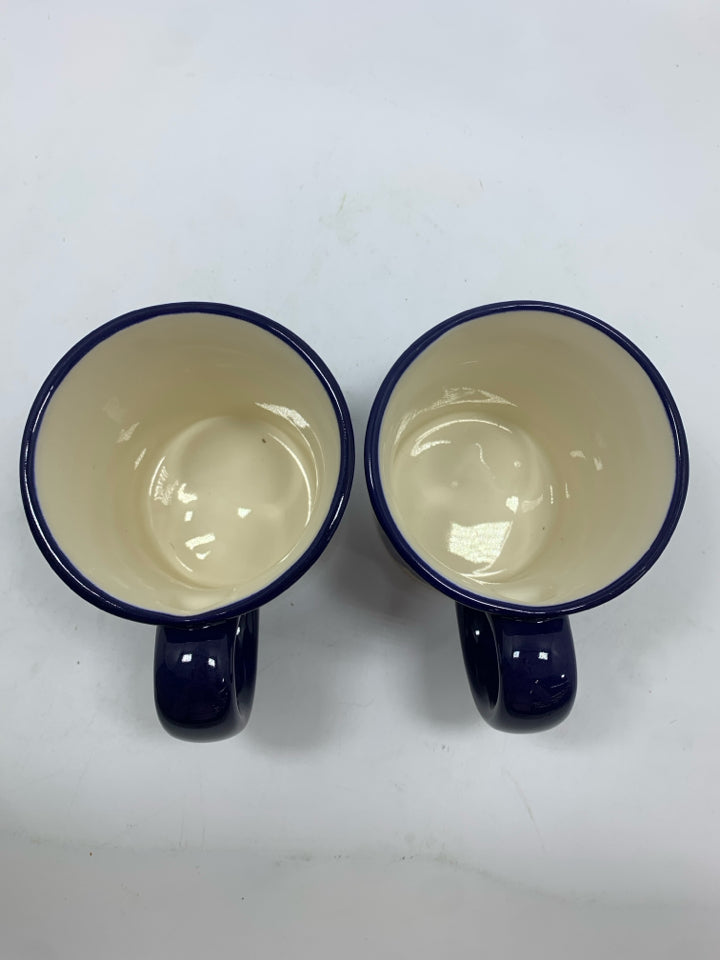 2 NAVY FLORAL PAINTED MUGS.