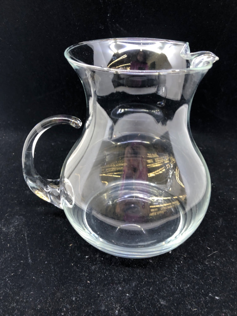 CLEAR GLASS PITCHER WITH ICE LIP.