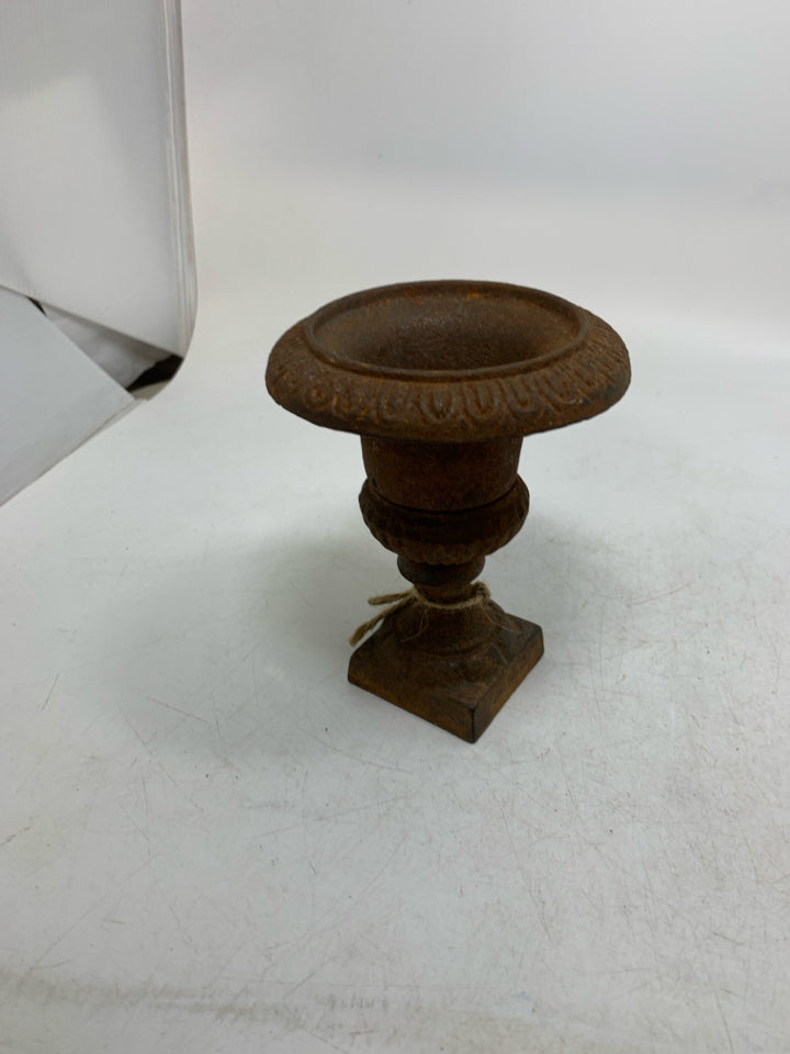 RUSTED HEAVY METAL FOOTED VASE.