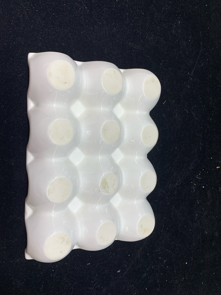 WHITE CERAMIC EGG HOLDER.