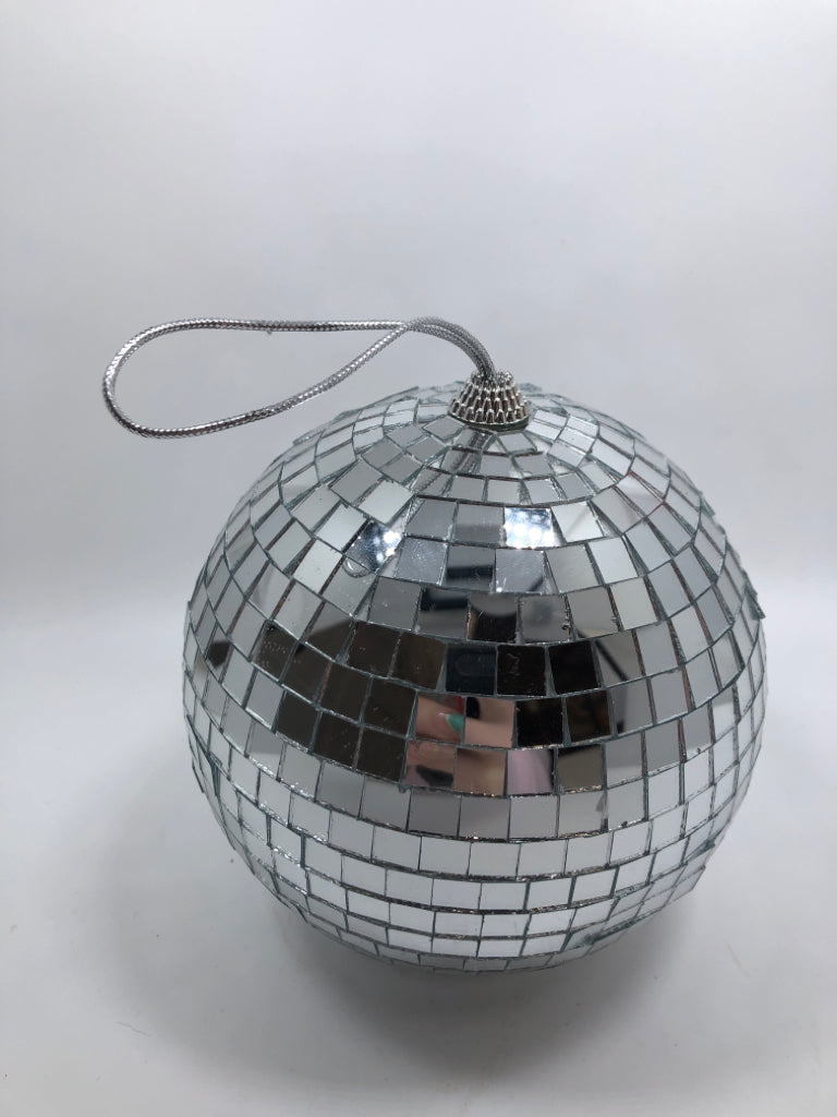 SILVER DISCO BALL ORNAMENT.