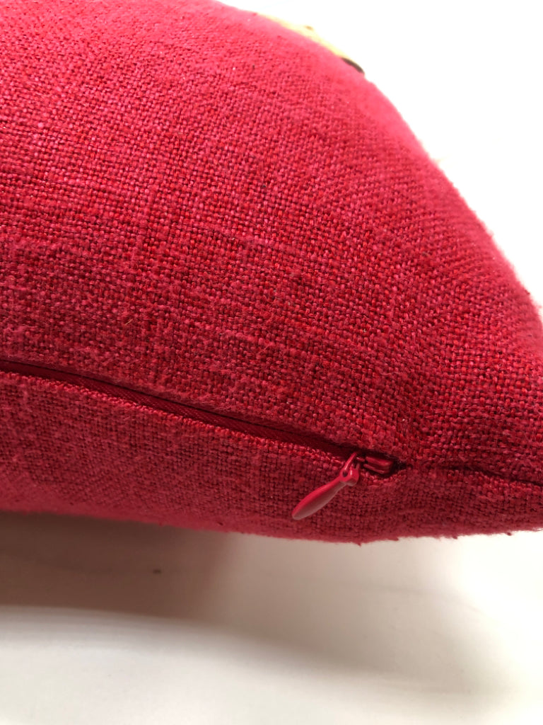 RED ACCENT PILLOW W/WOODEN BUTTONS.