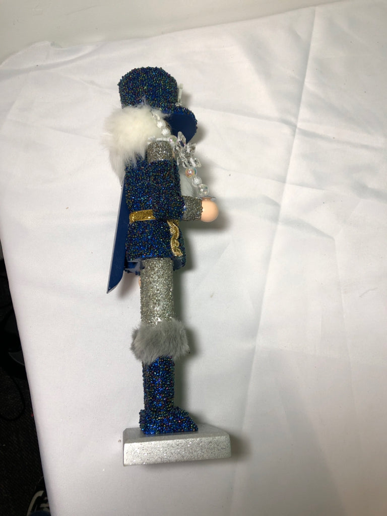 BLUE AND SILVER SNOWFLAKE NUT CRACKER.