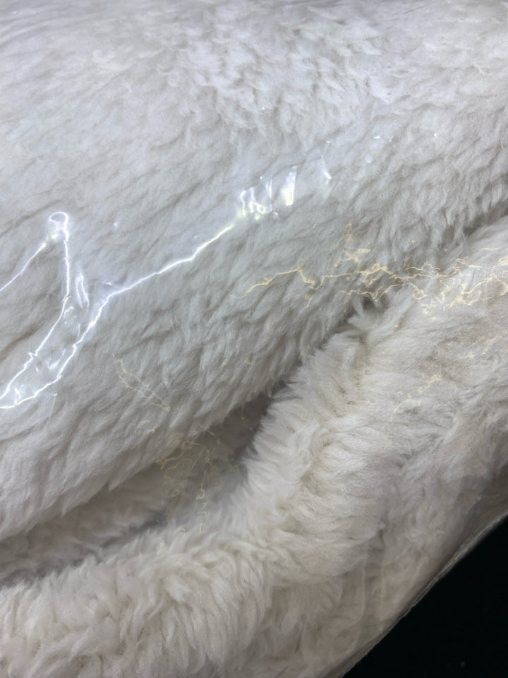 NIP PLUSH THROW.
