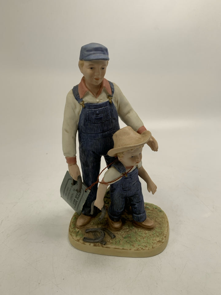 DENIM DAYS FATHER/BOY HOLDING HORSE SHOES.