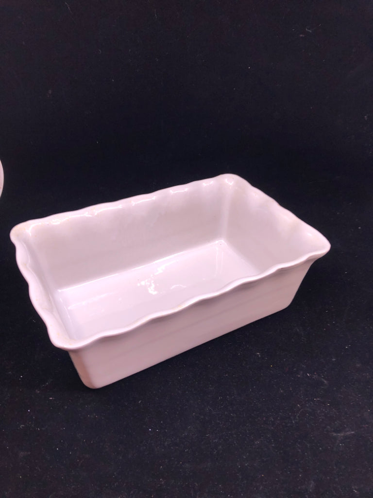WHITE WAVY EDGE STONEWARE LOAF PAN.