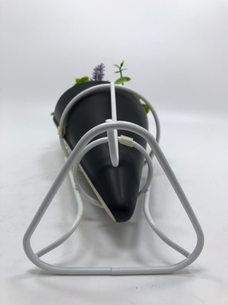 FAUX FLORALS IN STANDING PLANTER.