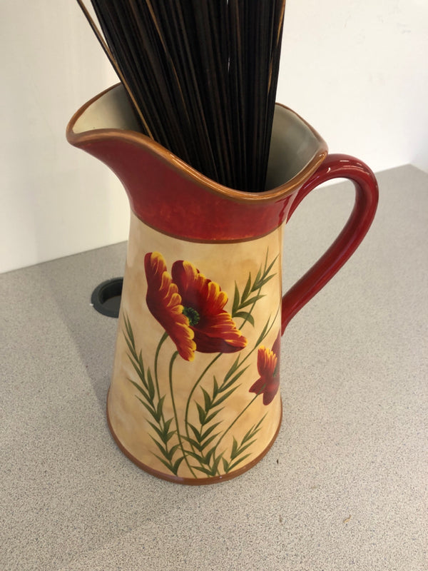 RED AND CREAM CERAMIC PITCHER W PAINTED RED FLORAL W RED LEAVES AND TWIGS FILLER