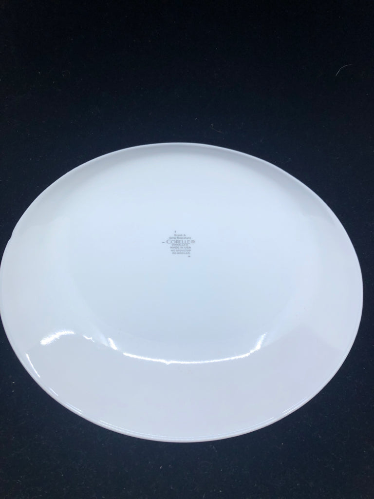 4 WHITE CORELLE DINNER PLATES W/MULTI COLOR SQUARES.