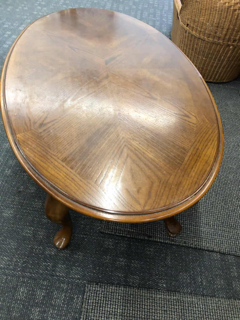 DARK WOOD OVAL COFFEE TABLE.