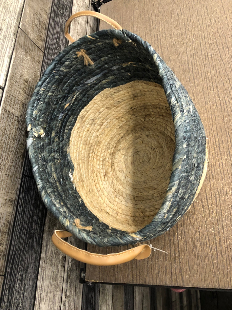 GRAY/BEIGE WOVEN BASKET W/FAUX LEATHER HANDLES.
