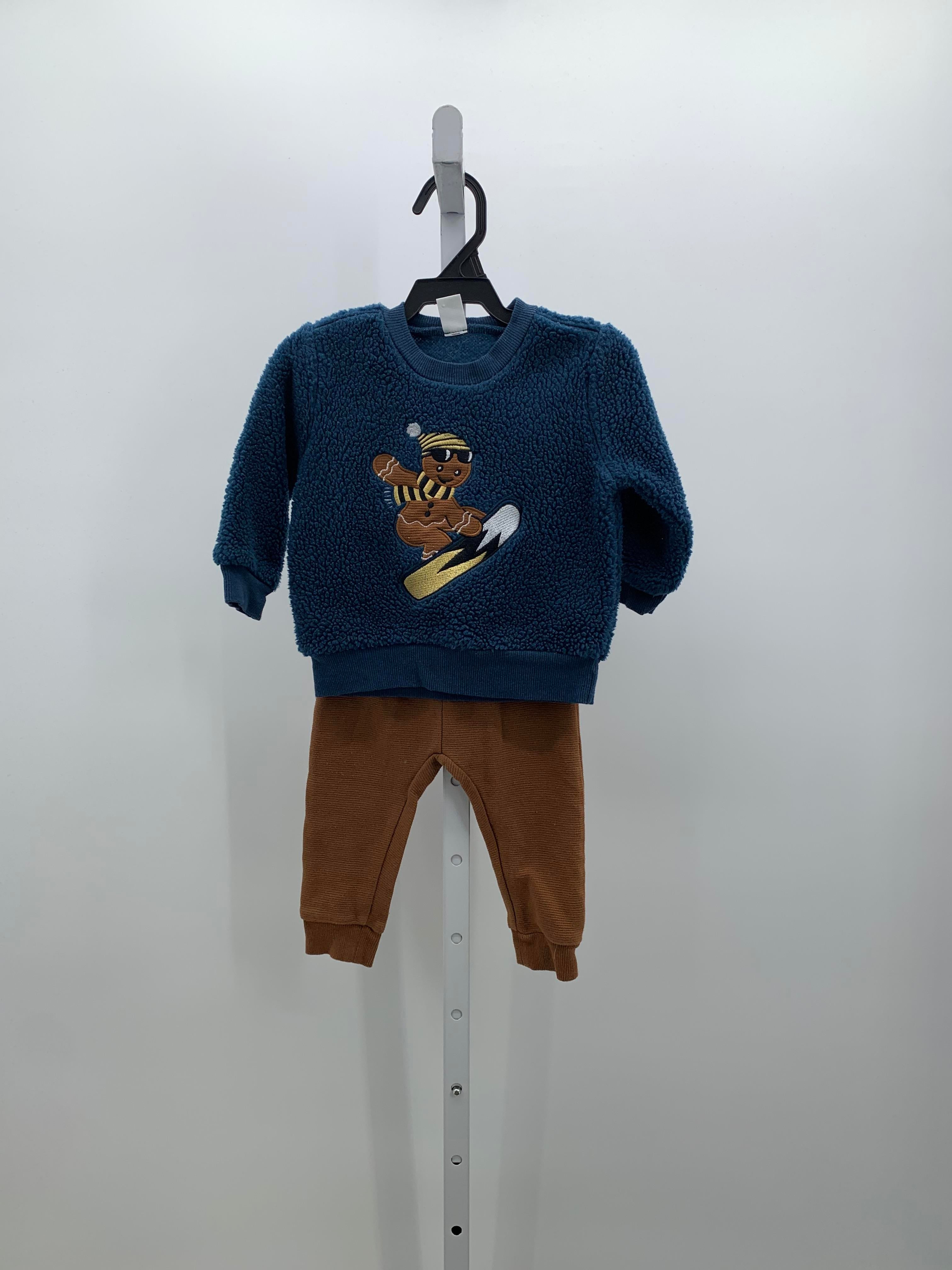 SHERPA GINGERBREAD MAN SHIRT AND BROWN PANTS.