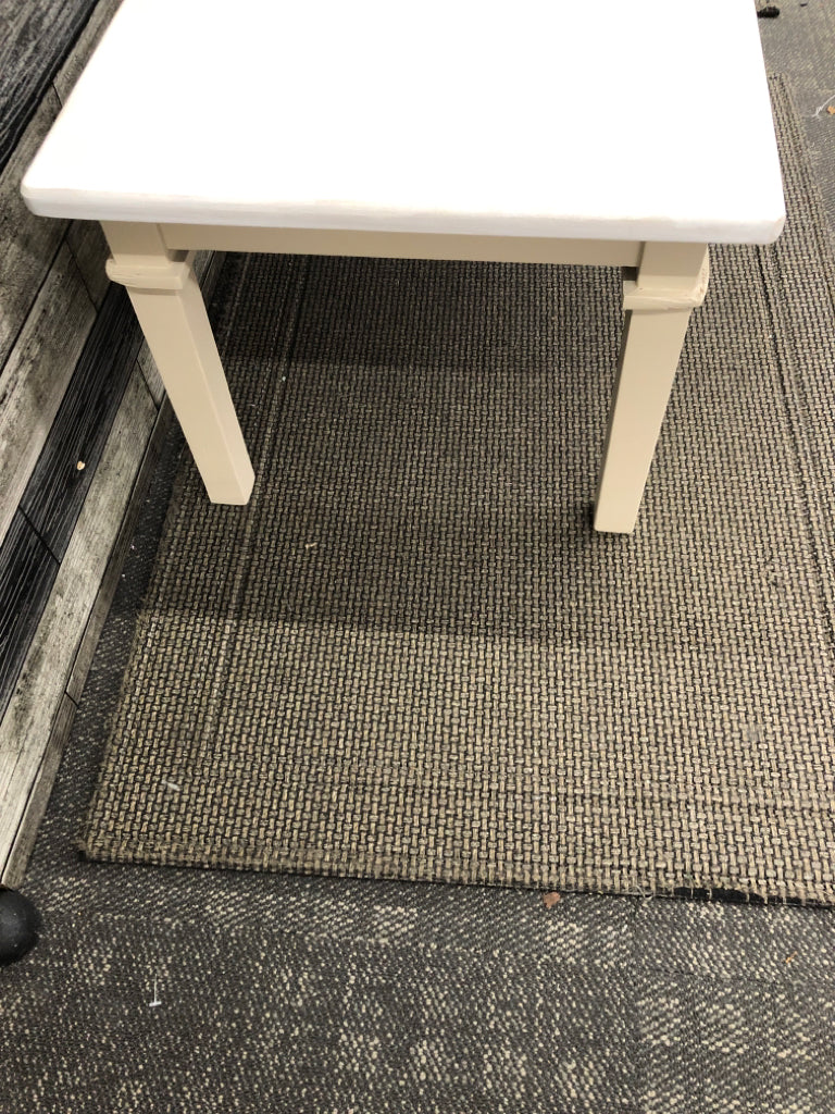 DISTRESSED WHITE TOP CREAM LEGS COFFEE TABLE.