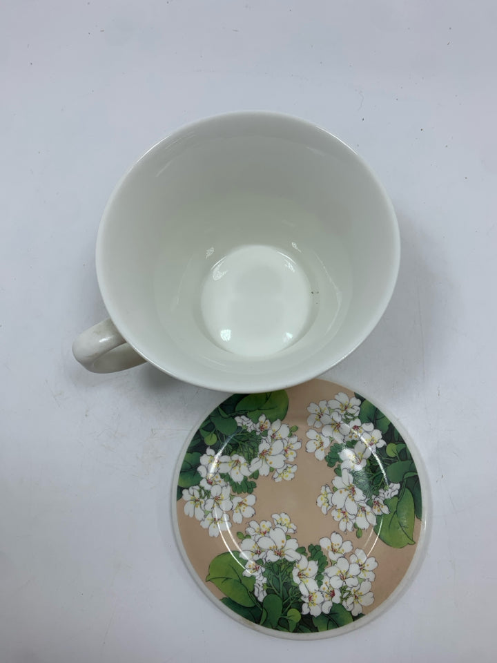 WHITE FLOWER COFFEE MUG W/LID.