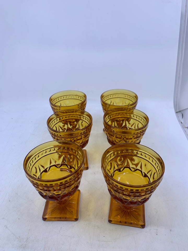 6 VTG FOOTED AMBER GLASSES W/ EMBOSSED DETAIL.