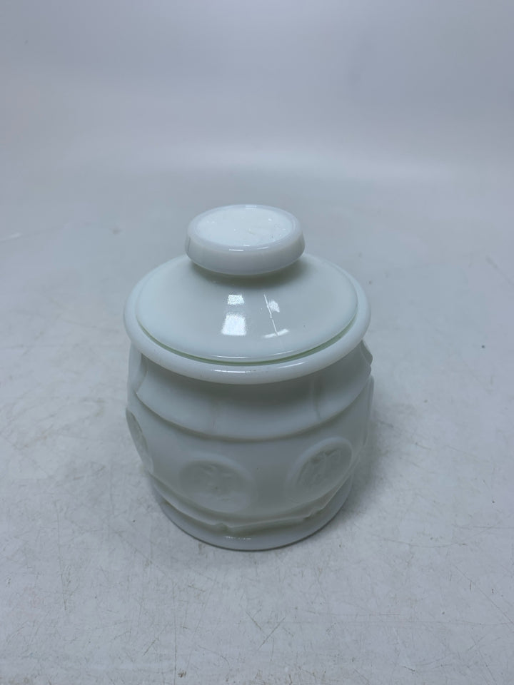 VTG SMALL MILK GLASS CANISTER W/ EAGLE COIN DETAILS.