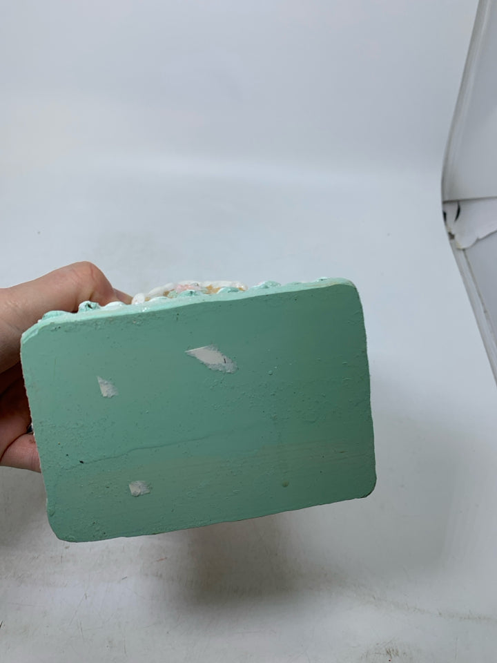 RESIN PASTEL COLORED SPARKLE GINGERBREAD HOUSE.