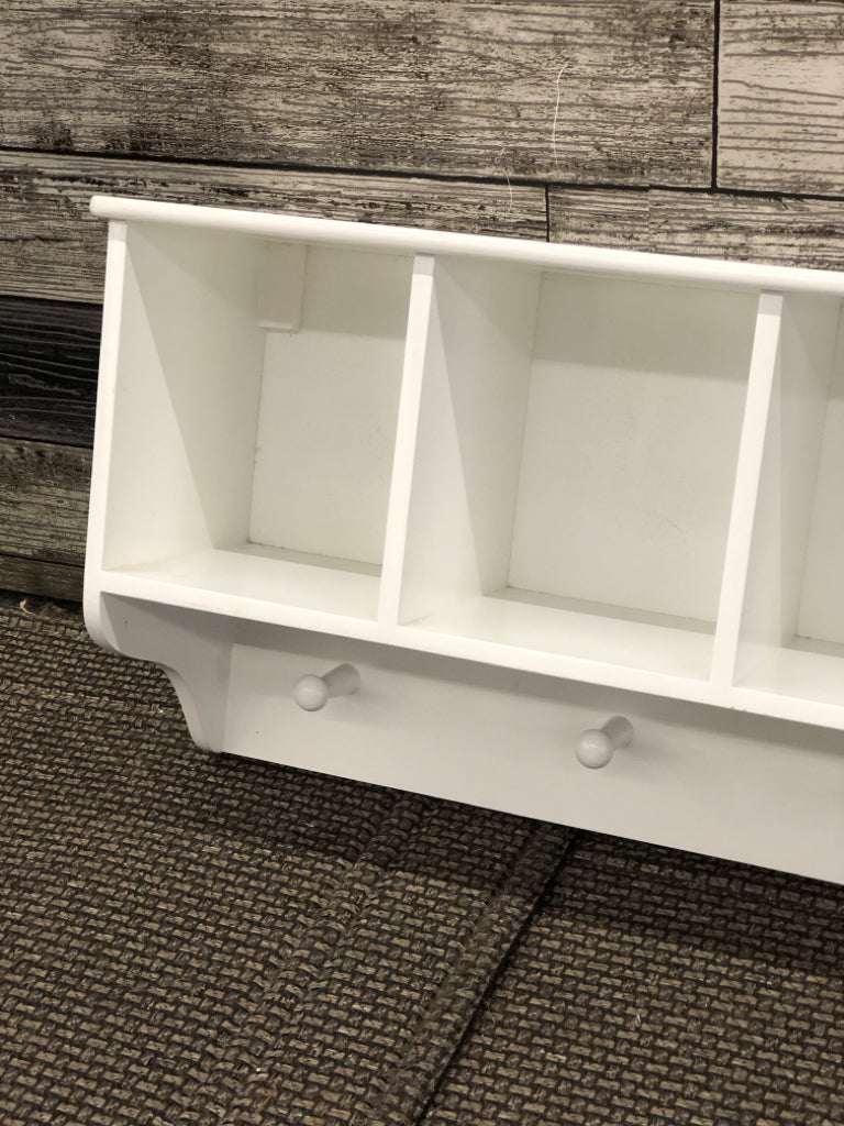 WHITE CUBBY WALL SHELF W/COAT HOOKS.