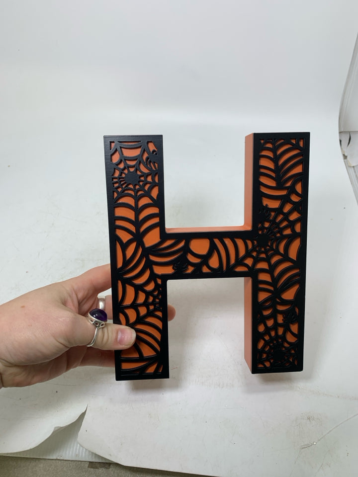 BLACK SPIDER WEB DESIGN MONOGRAM ORANGE H.