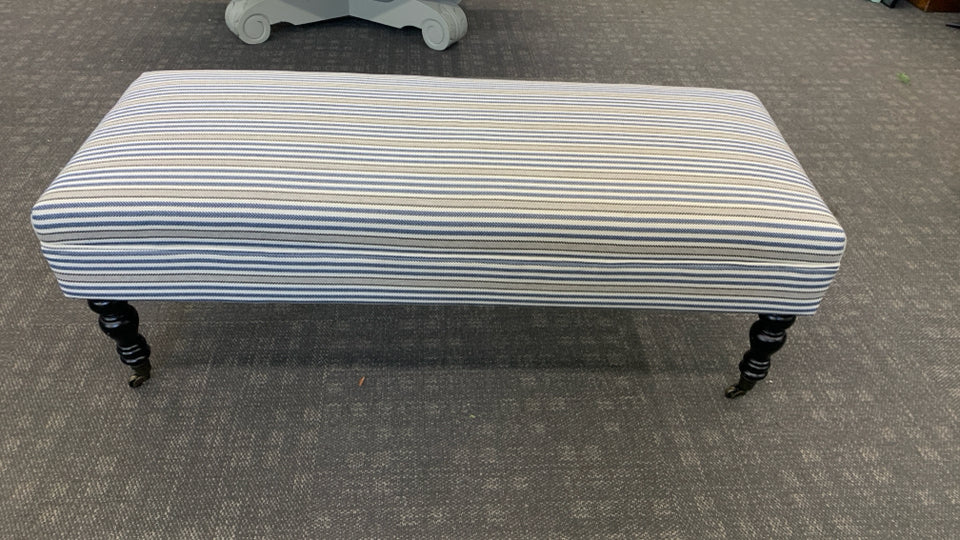 LONG BLUE STRIPPED OTTOMAN/BENCH ON WHEELS.