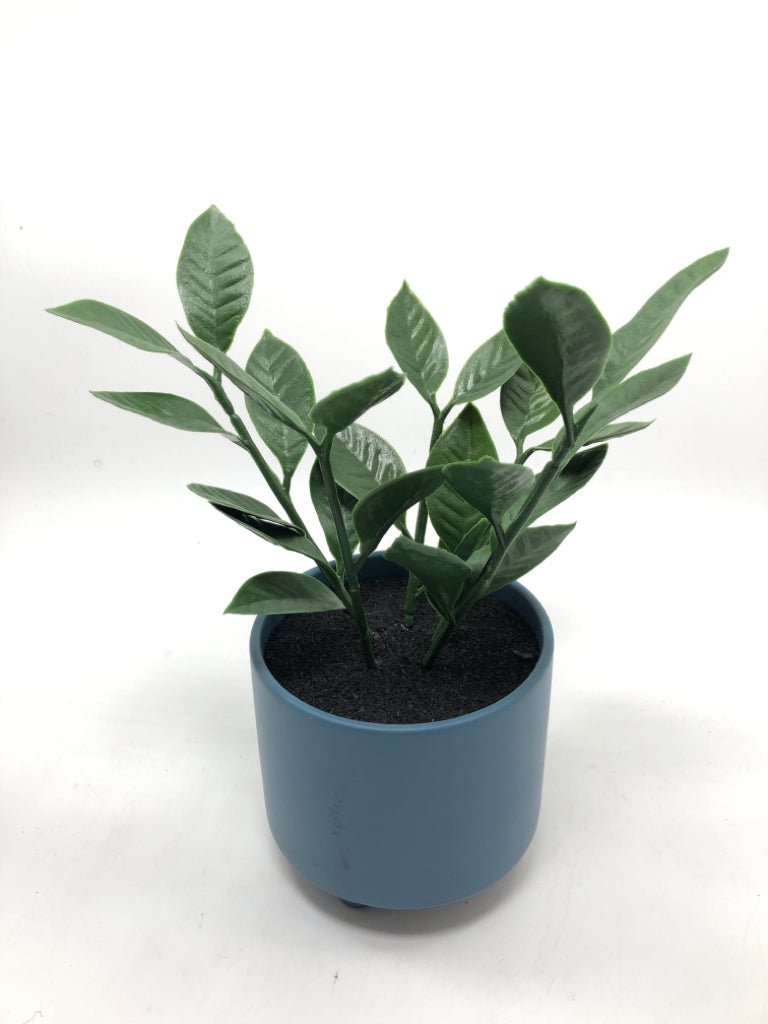 FAUX GREENERY IN BLUE PLANTER.