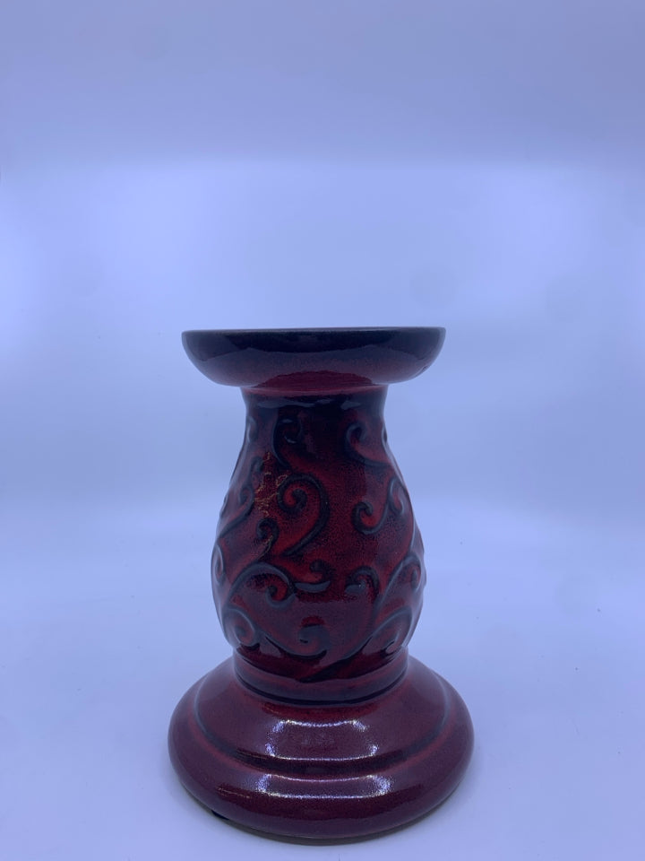 RED PILLAR CANDLE HOLDER.