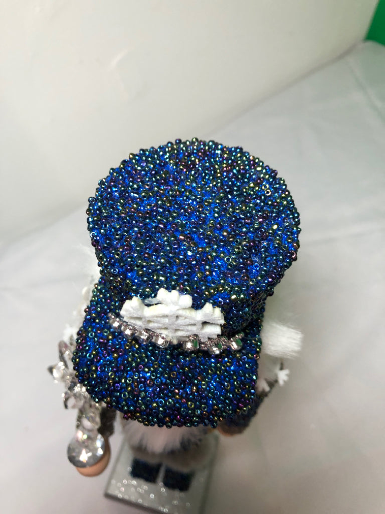 BLUE AND SILVER SNOWFLAKE NUT CRACKER.