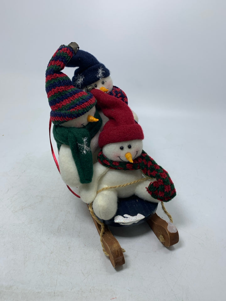 3 PLUSH SNOWMEN ON SLED SMALL.