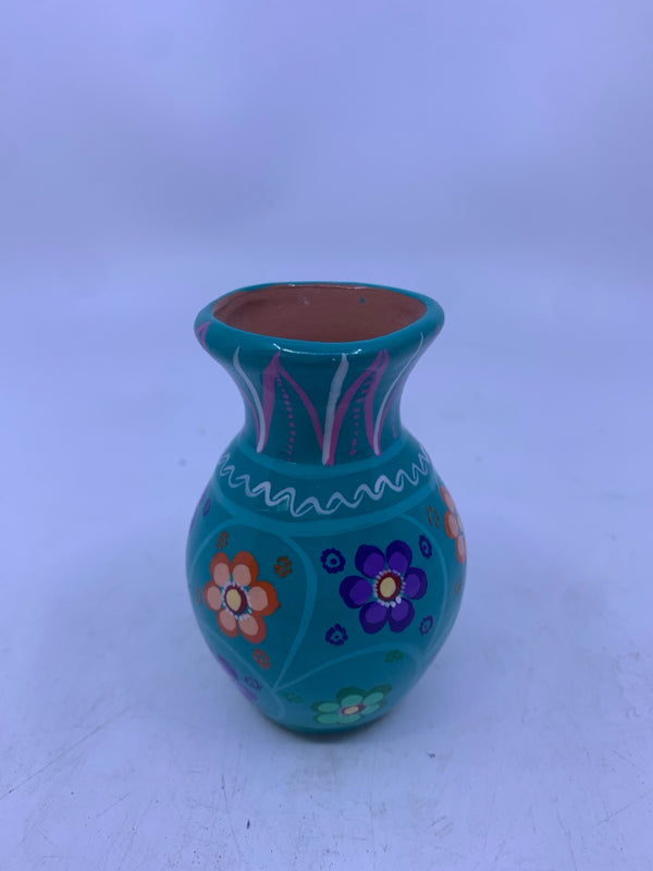 SMALL TEAL TERRA COTTA VASE W/ COLORFUL FLOWERS.