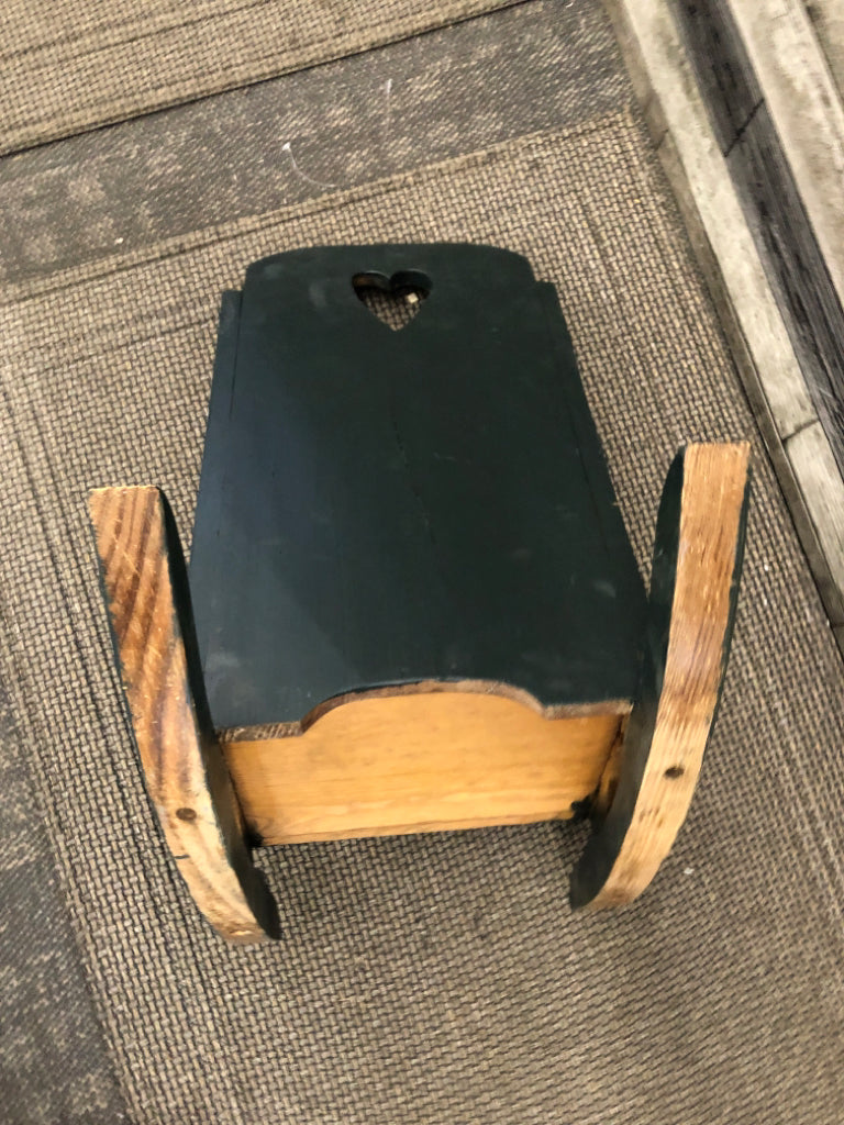SMALL GREEN DECORTIVE ROCKING CHAIR.