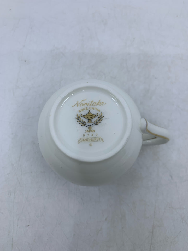 WHITE TEA CUP W/ BLUE/GOLD EDGE & FLOWERS.