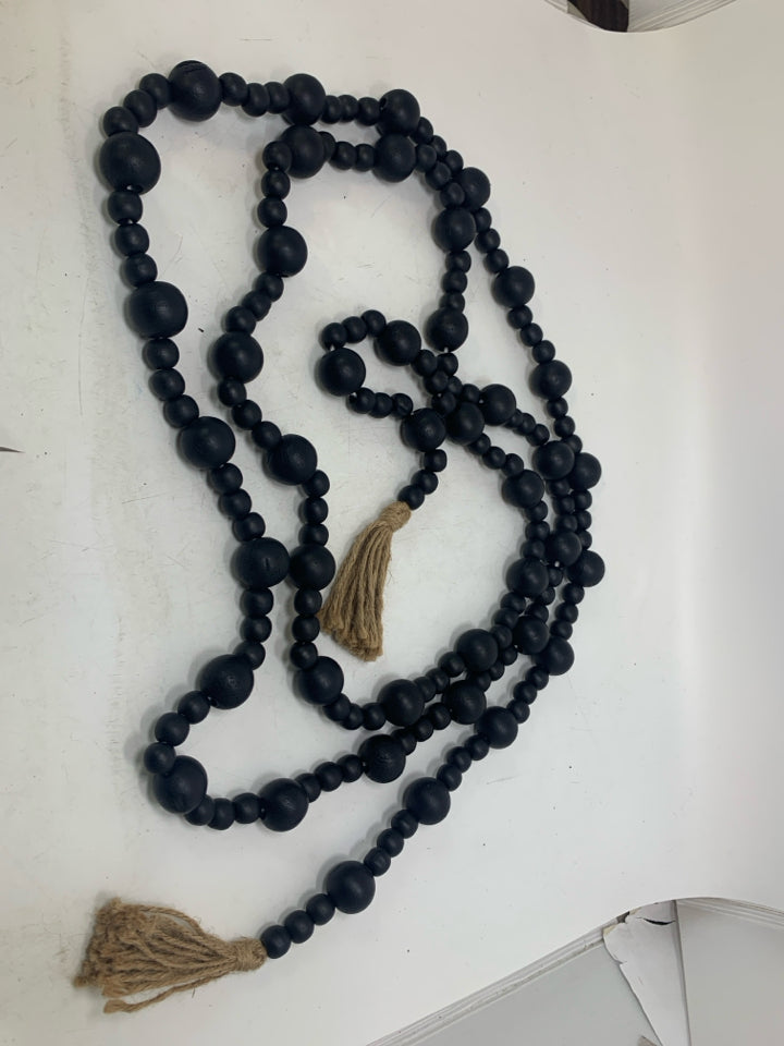 BLACK BEADS W/ TASSELS GARLAND.