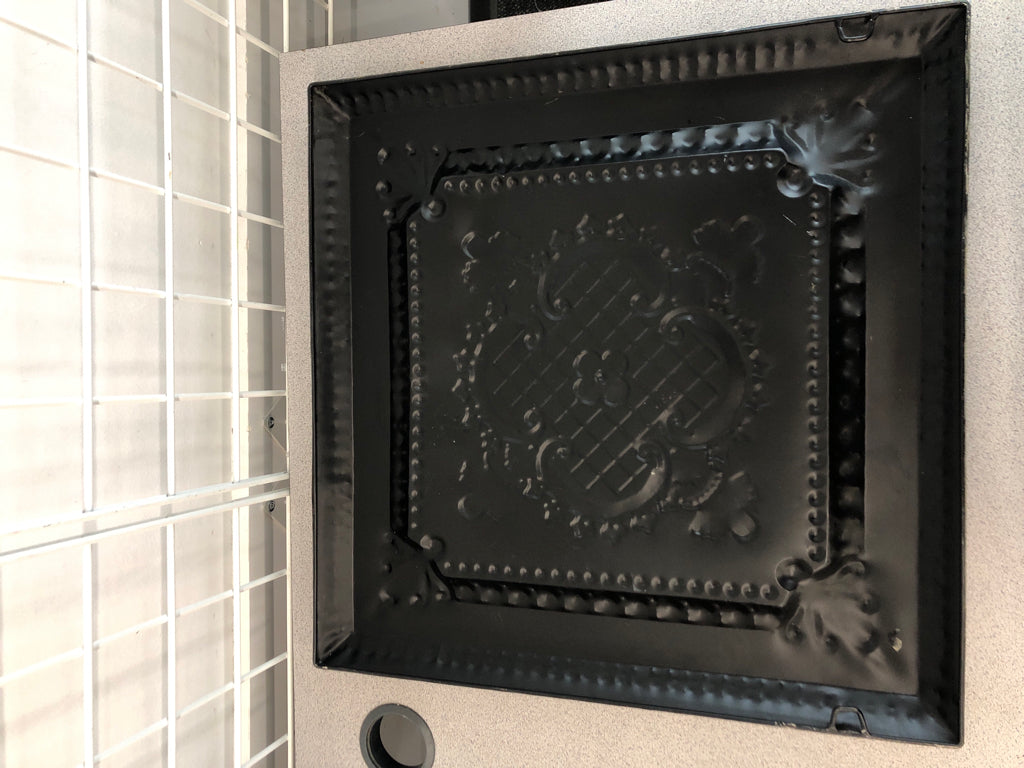 BROWN EMBOSSED METAL TILE.