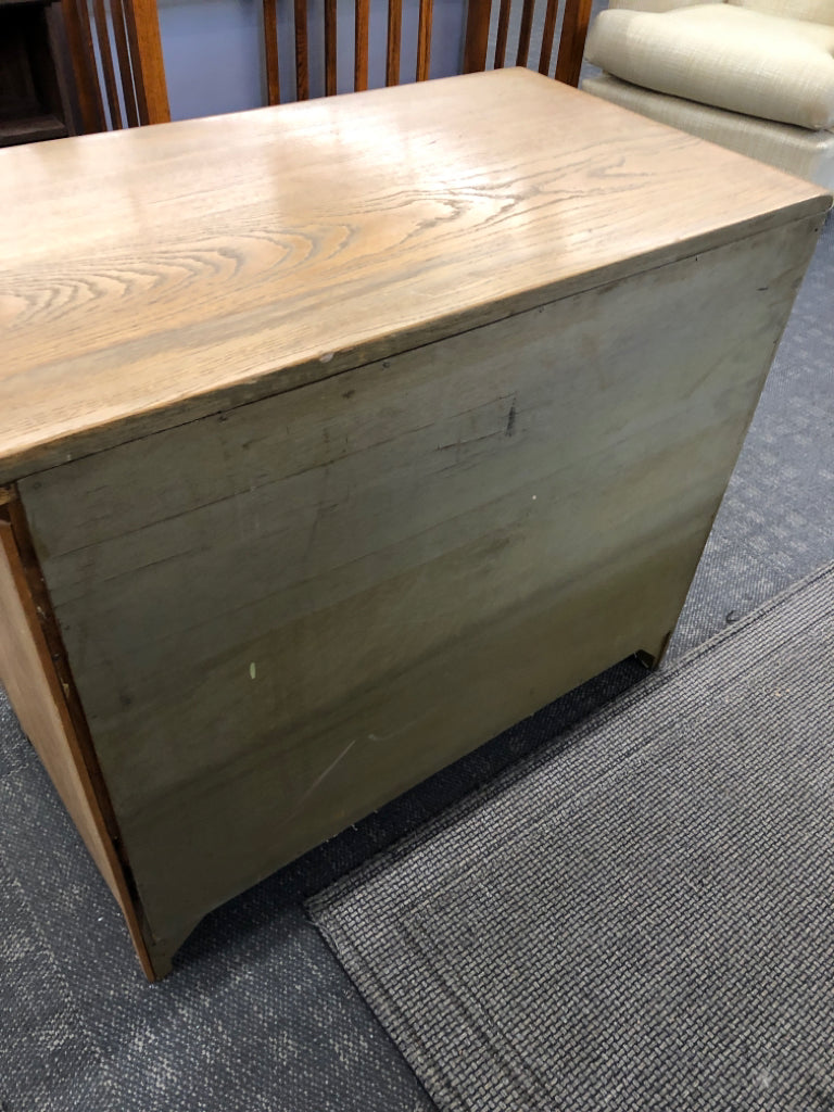 4 DRAWER LIGHT WOOD LOW DRESSER W/BRASS HANDLES.