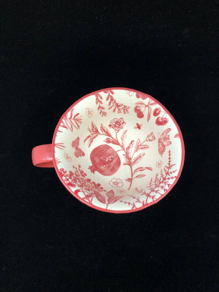 RED MUG W/FLORAL DETAILS INSIDE.
