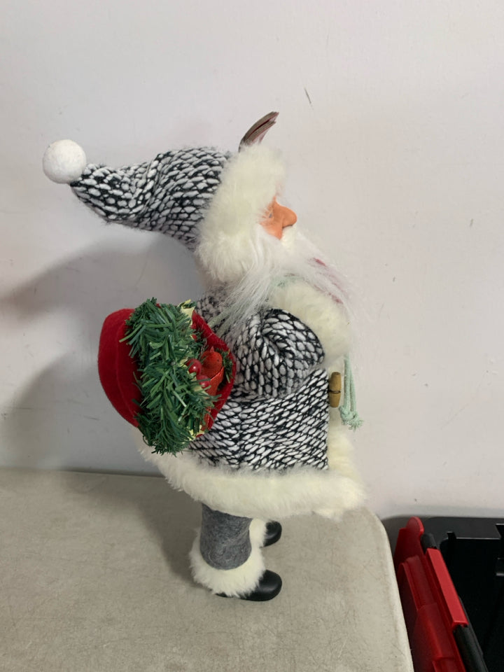 STANDING SANTA W/ SKIS BLACK/WHITE KNIT SUIT.