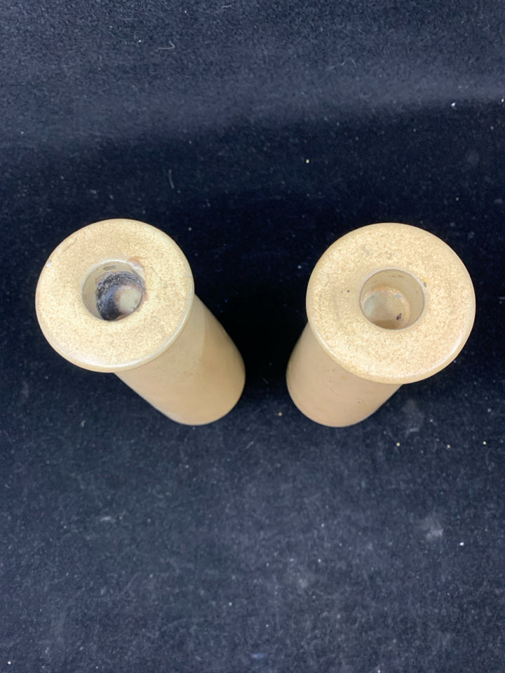 2 TAN CERAMIC TAPER CANDLE STICK HOLDERS.