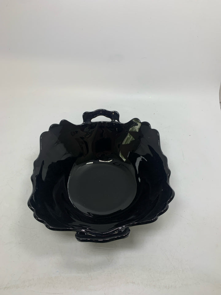 VTG FOOTED BLACK GLASS BOWL W/ HANDLES.