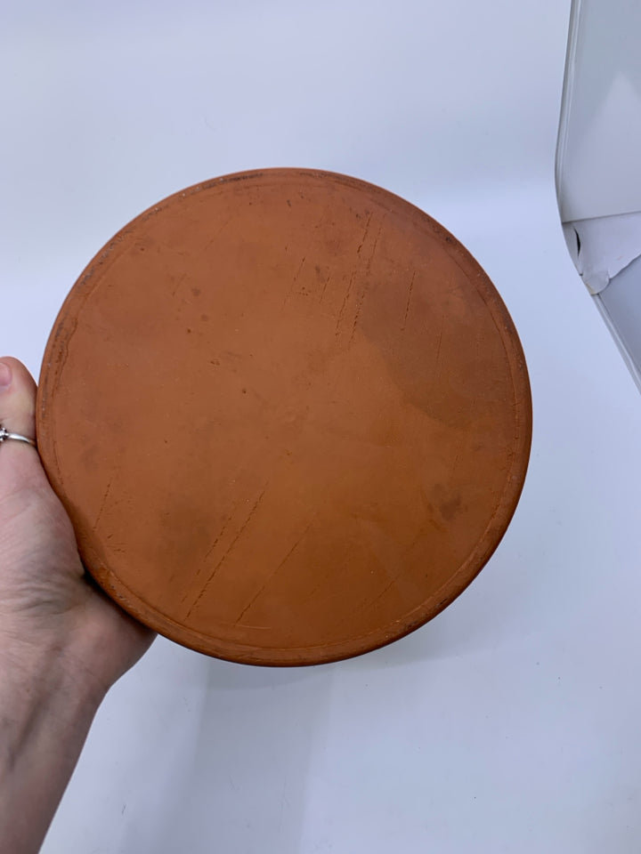 TERRA COTTA TORTILLA WARMER W/ PEPPERS ON IT.