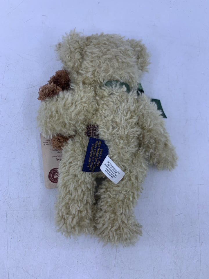 SMALL BEIGE SHAG BEAR HOLDING BROWN BEAR.