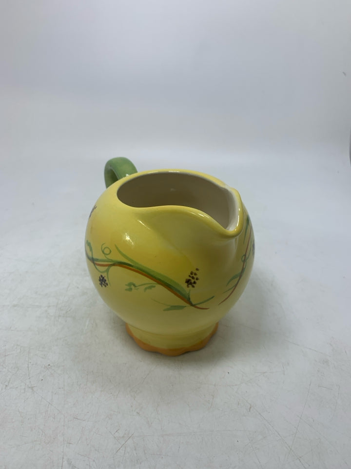 FOOTED CREAMER W/ VINE DETAILS.