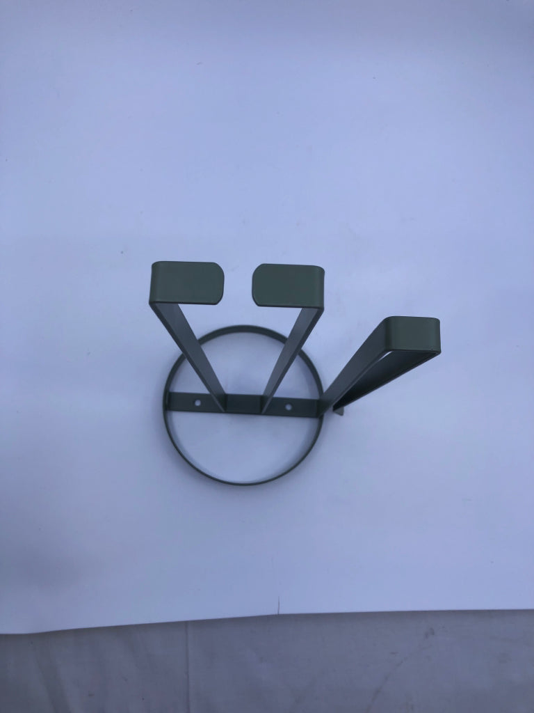 GREEN METAL PAPER TOWEL HOLDER.