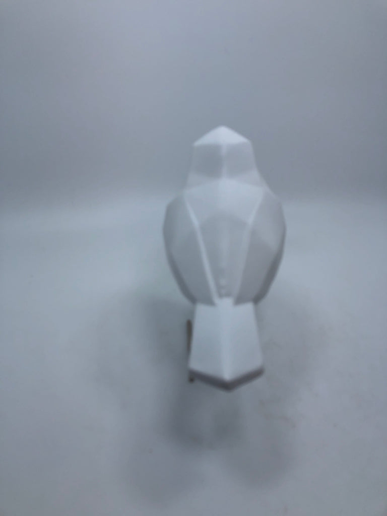 WHITE PLASTIC BIRD W/GOLD FEET.